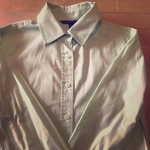 Mint green button down shirt.